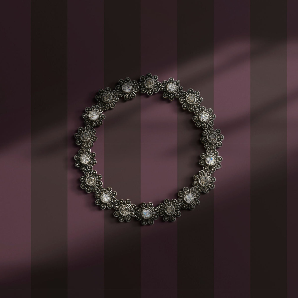 Dark moody mauve striped wallpaper.