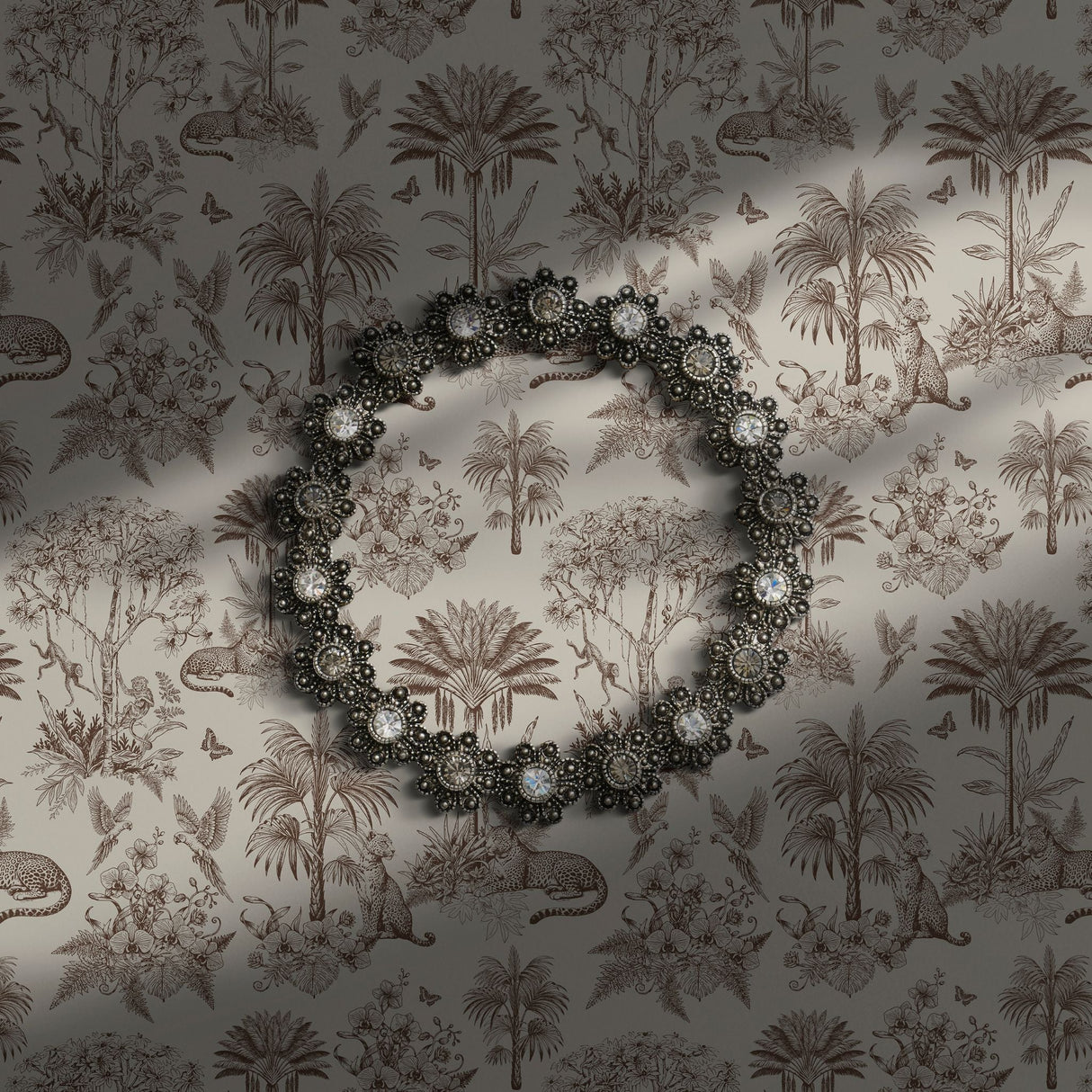 A taupe toile-pattern featuring palm trees and animals.
