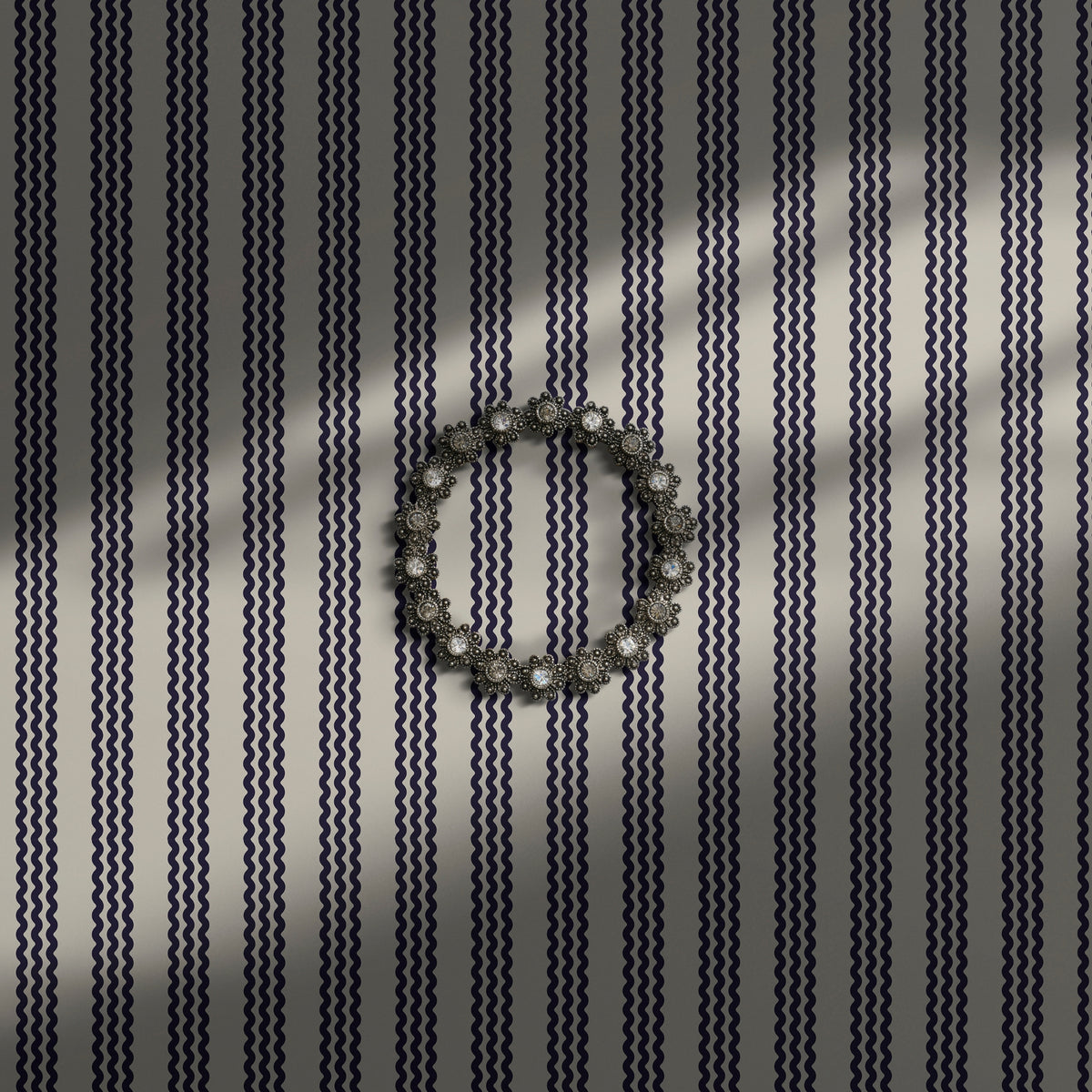 Beige navy blue wavy striped wallpaper.
