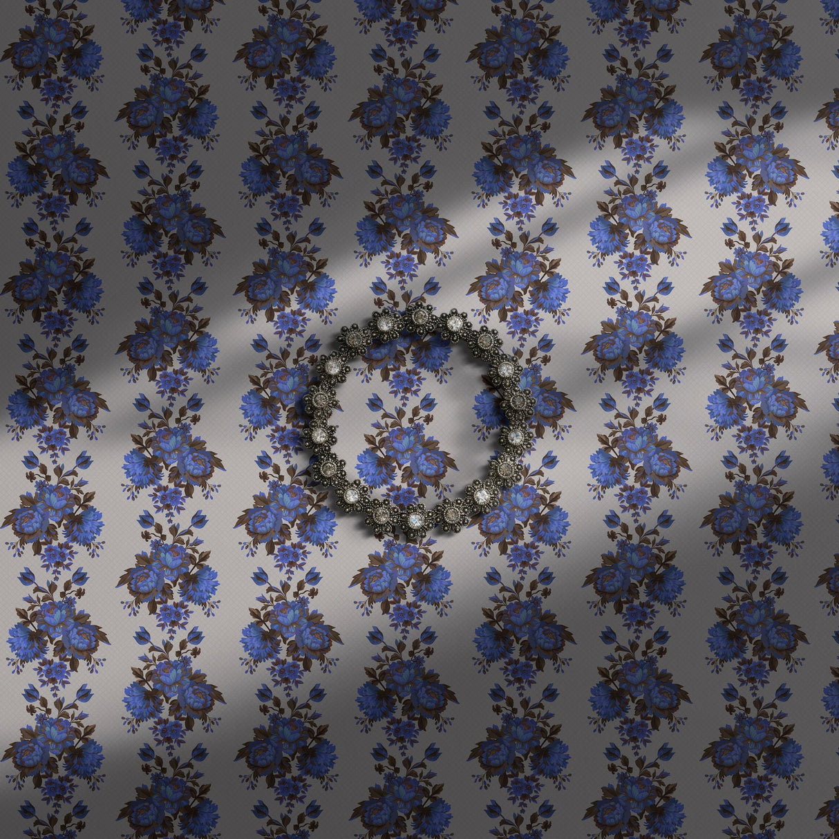 Vintage blue striped floral wallpaper on a light neutral background.