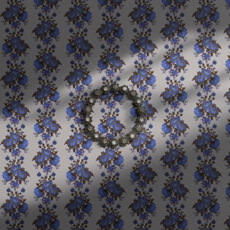 Vintage blue striped floral wallpaper on a light neutral background.