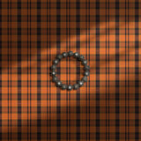 Bright orange maximalist plaid wallpaper.
