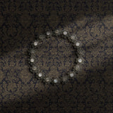 Brown damask wallpaper on a moody blue/gray background.