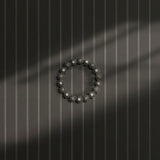 Charcoal gray spotted striped wallpaper.