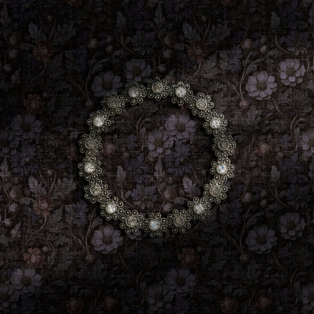 Dark academia floral wallpaper with blue undertones.
