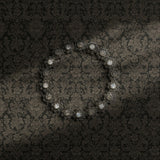 Dark moody brown damask wallpaper.