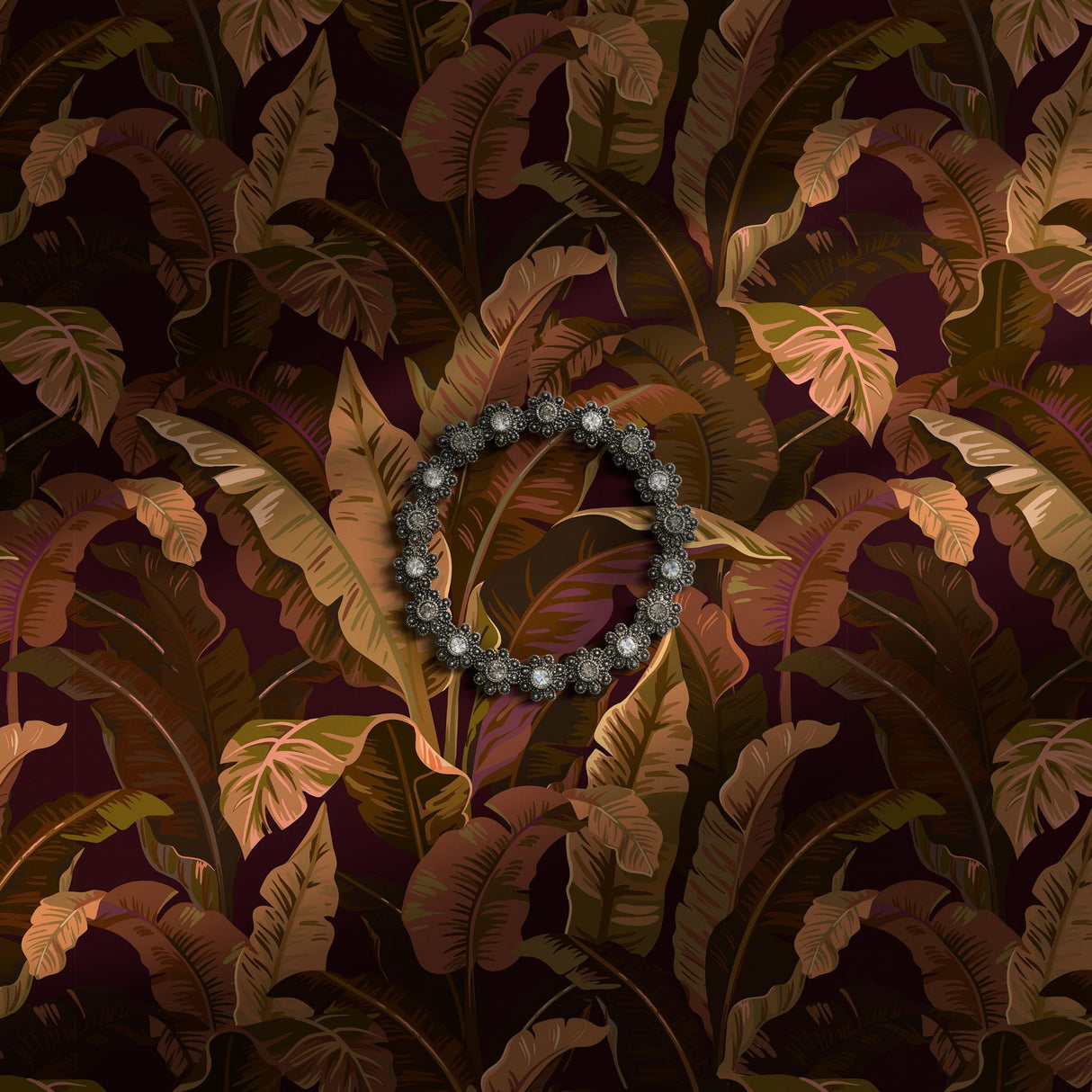 Dark and moody brown, maroon, and green tropical wallpaper.