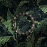 Dark and moody green tropical banana leaves wallpaper.