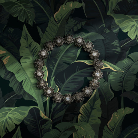 Dark and moody green tropical banana leaves wallpaper.