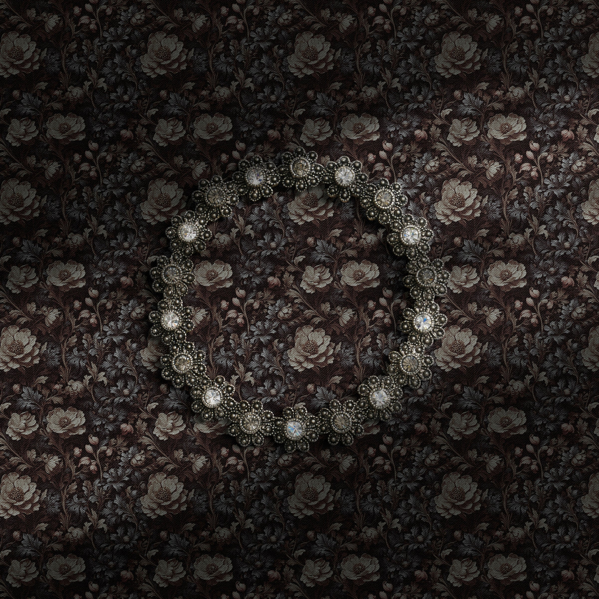 A dark and moody upscale vintage floral wallpaper.