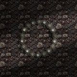 A dark and moody upscale vintage floral wallpaper.