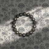 Gray and white tropical toile wallpaper.