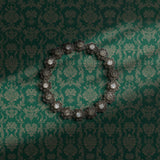 Green damask wallpaper.