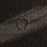 Moody dark damask wallpaper on a gray/blue background.