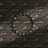 A muted old-world floral wallpaper.