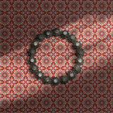 Peach and maroon tiled wallpaper.