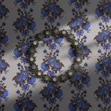 Vintage blue floral wallpaper on a light neutral background.