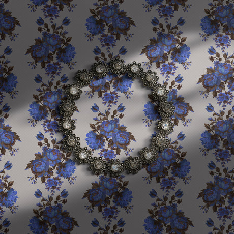 Vintage blue floral wallpaper on a light neutral background.