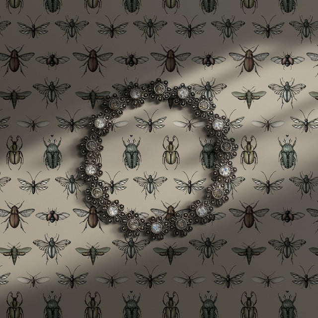 Vintage insect wallpaper on a cream background.