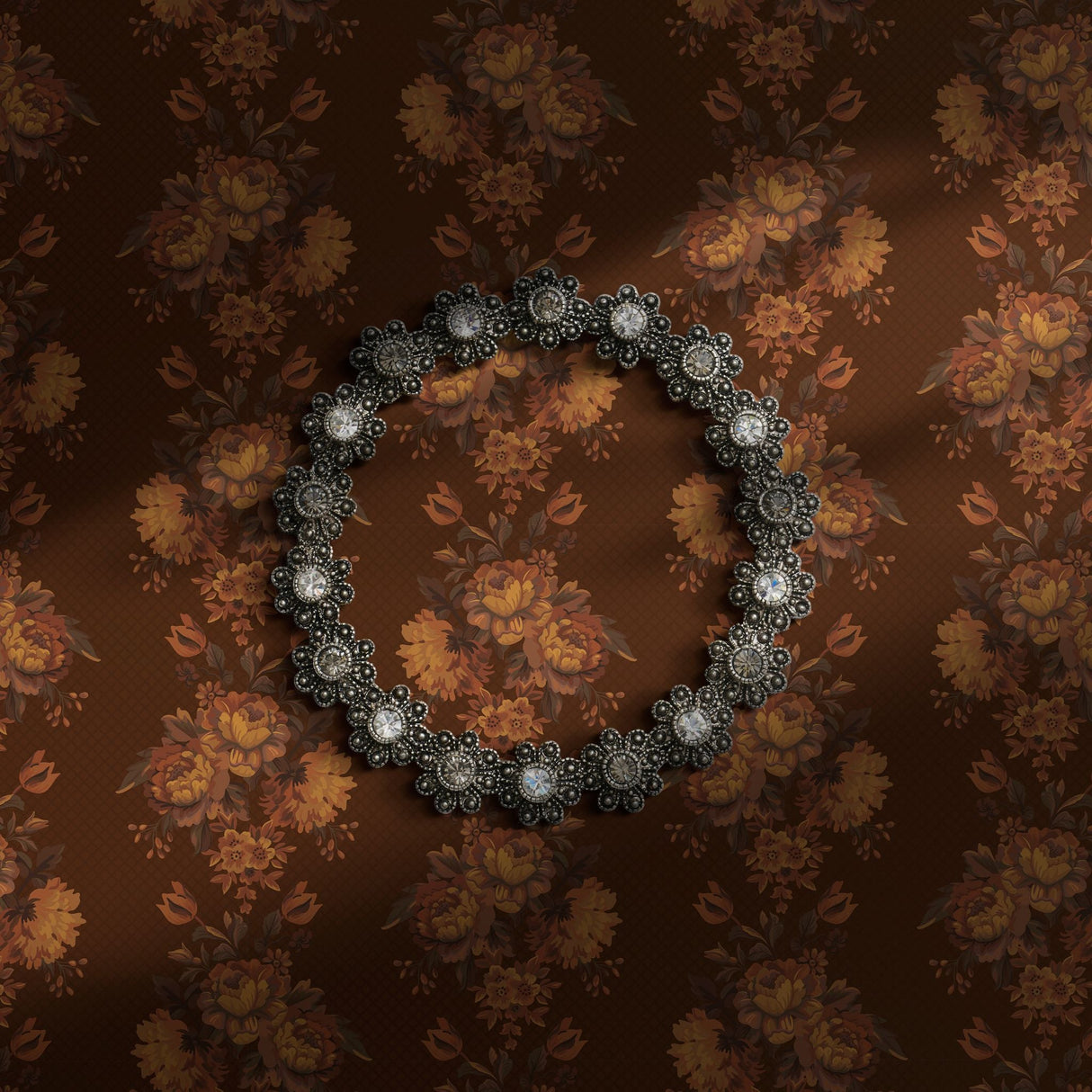 A warm brown vintage floral wallpaper.