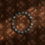 A warm brown vintage floral wallpaper.